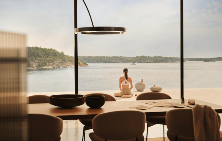 table with person doing yoga outside in background