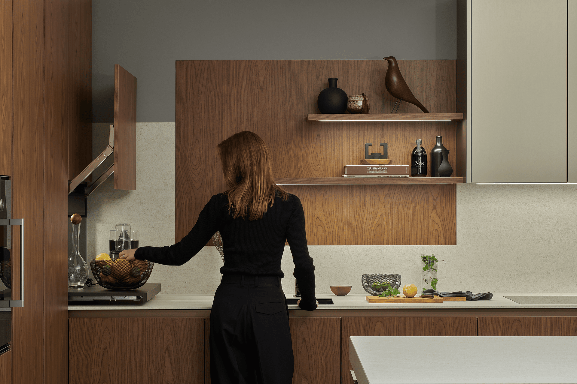 woman at the kitchens ink touching fruit bowl